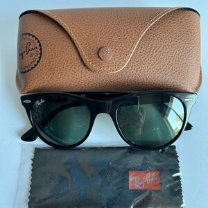 Ray Bans model RB2185. Black frames. Round lenses. In excellent condition.